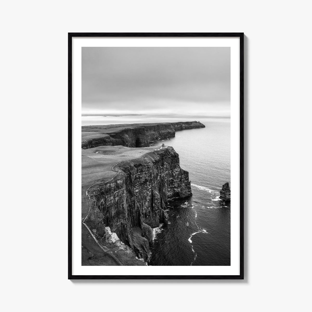 Sunset Cliffs black & white photo poster of San Diego, California – vertical wall art, unframed print shown in interior mocku