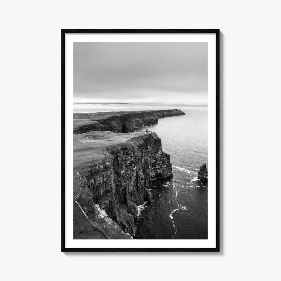 Sunset Cliffs black & white photo poster of San Diego, California – vertical wall art, unframed print shown in interior mocku