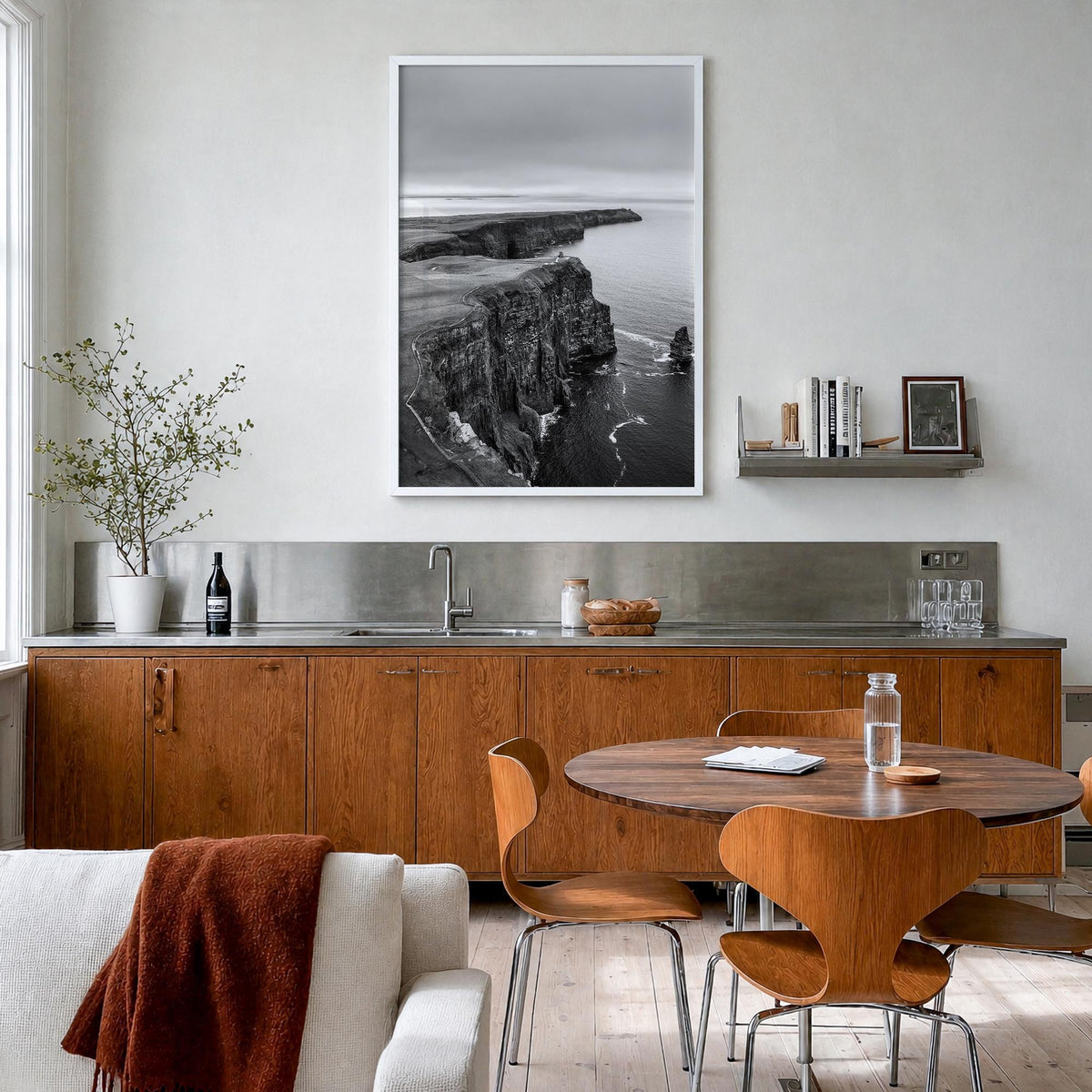 Sunset Cliffs black & white photo poster of San Diego, California – vertical wall art in white wood frame, hanging on wall