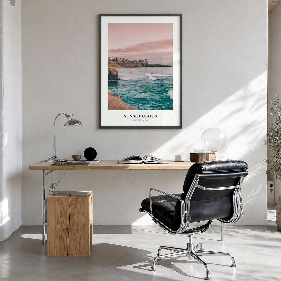 Sunset Cliffs Classic Poster in a black wood frame, hanging in a bright home office