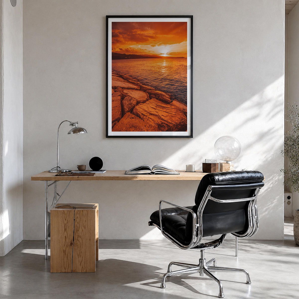 Sunset Coast colorful photo poster – vertical wall art in black wood frame with white border, hanging on wall
