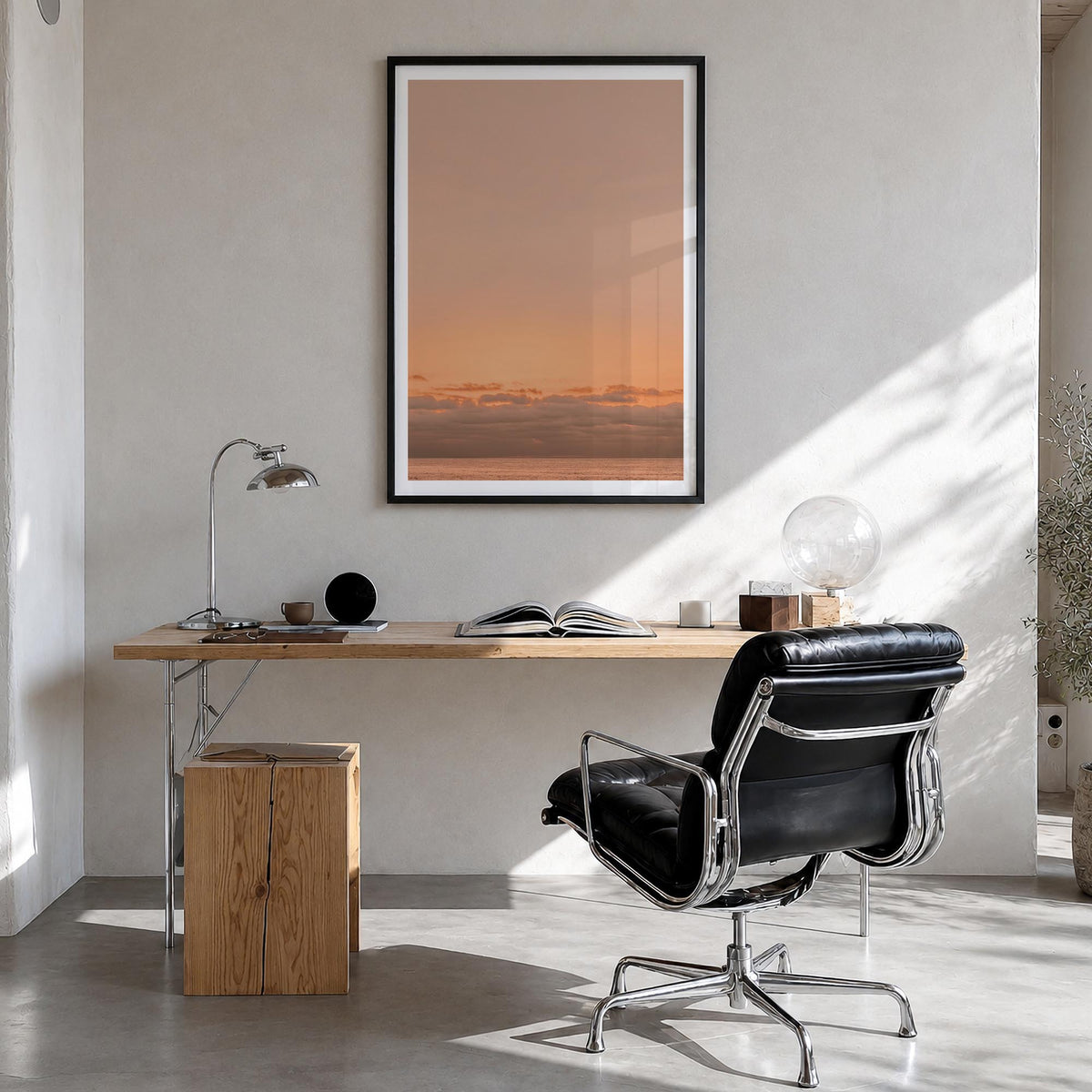 Sunset Ocean no. 1 colorful photo poster – vertical wall art in black wood frame with white border, hanging on wall
