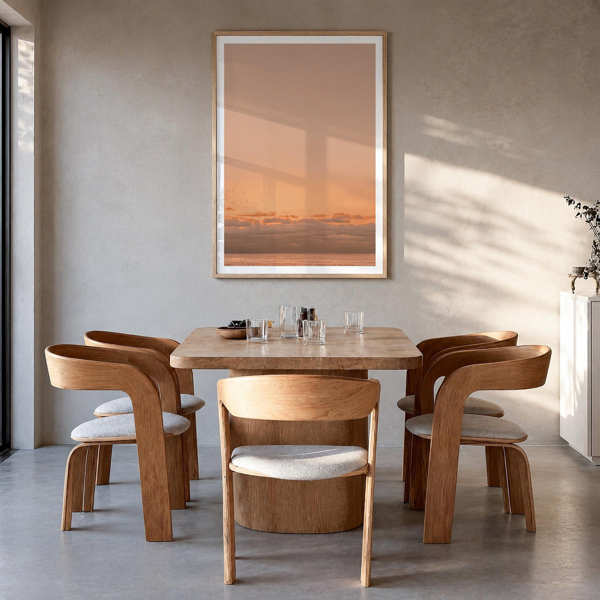 Sunset Ocean no. 1 colorful photo poster – vertical wall art in natural wood frame with white border, hanging on wall