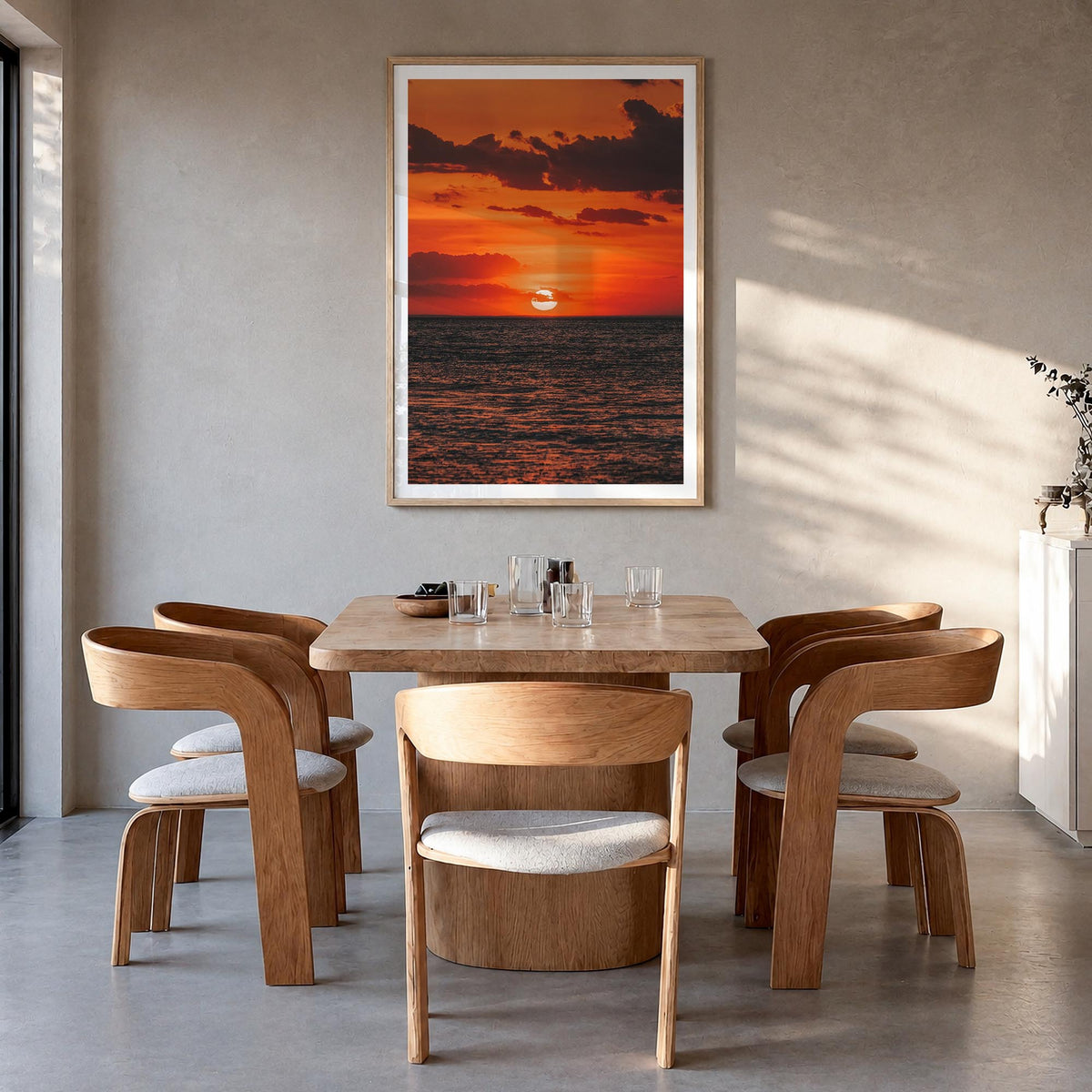 Sunset Ocean no. 2 colorful photo poster – vertical wall art in natural wood frame with white border, hanging on wall