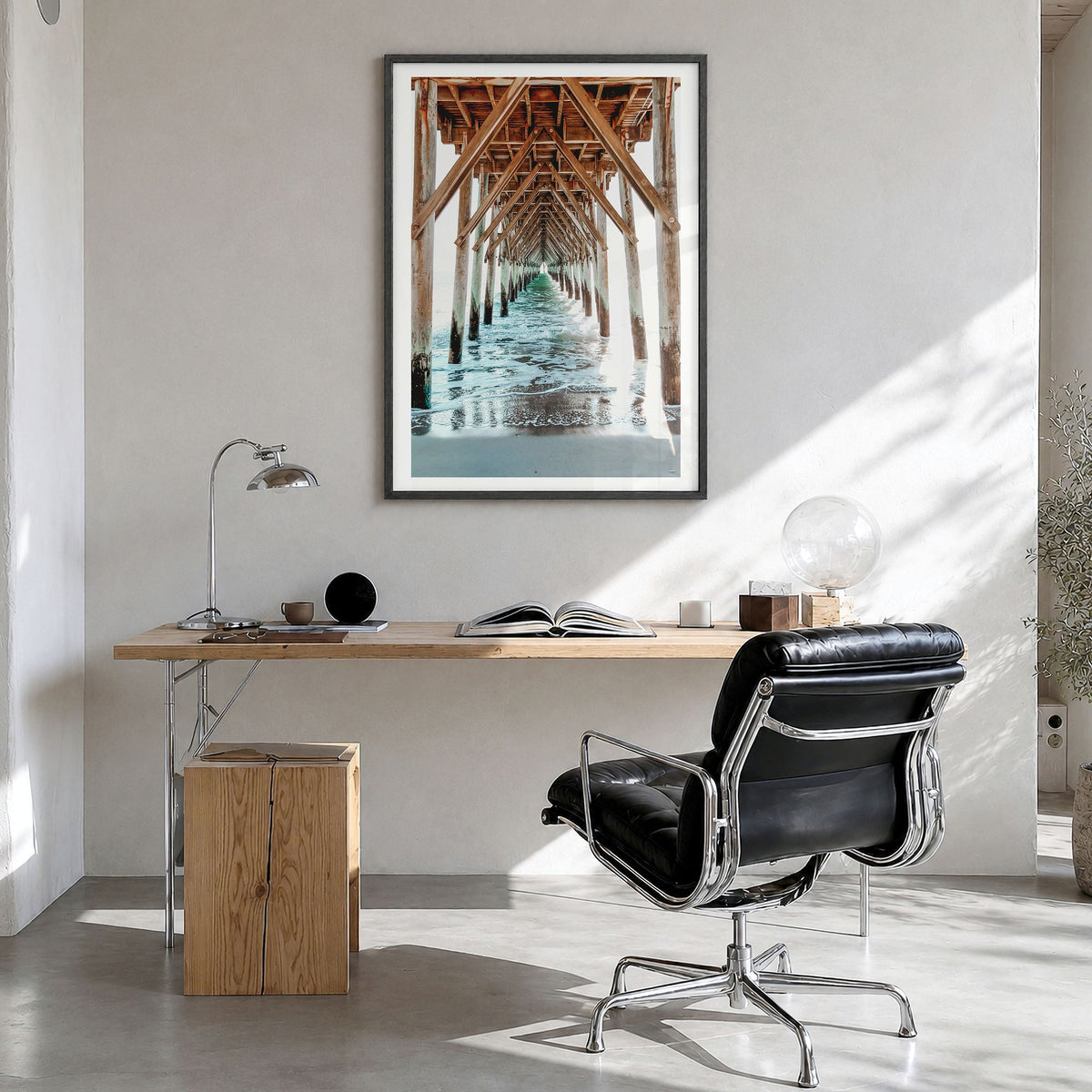 Surf City Photo Poster in a black wood frame, hanging in a bright home office, white border