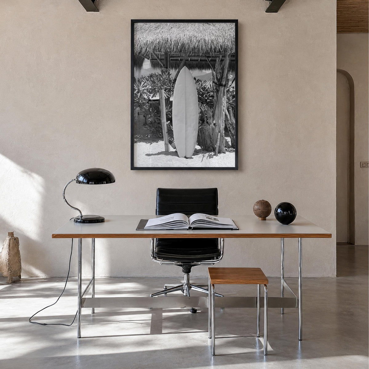 Surfboard no. 1 black & white photo poster – vertical wall art in black wood frame, hanging on wall