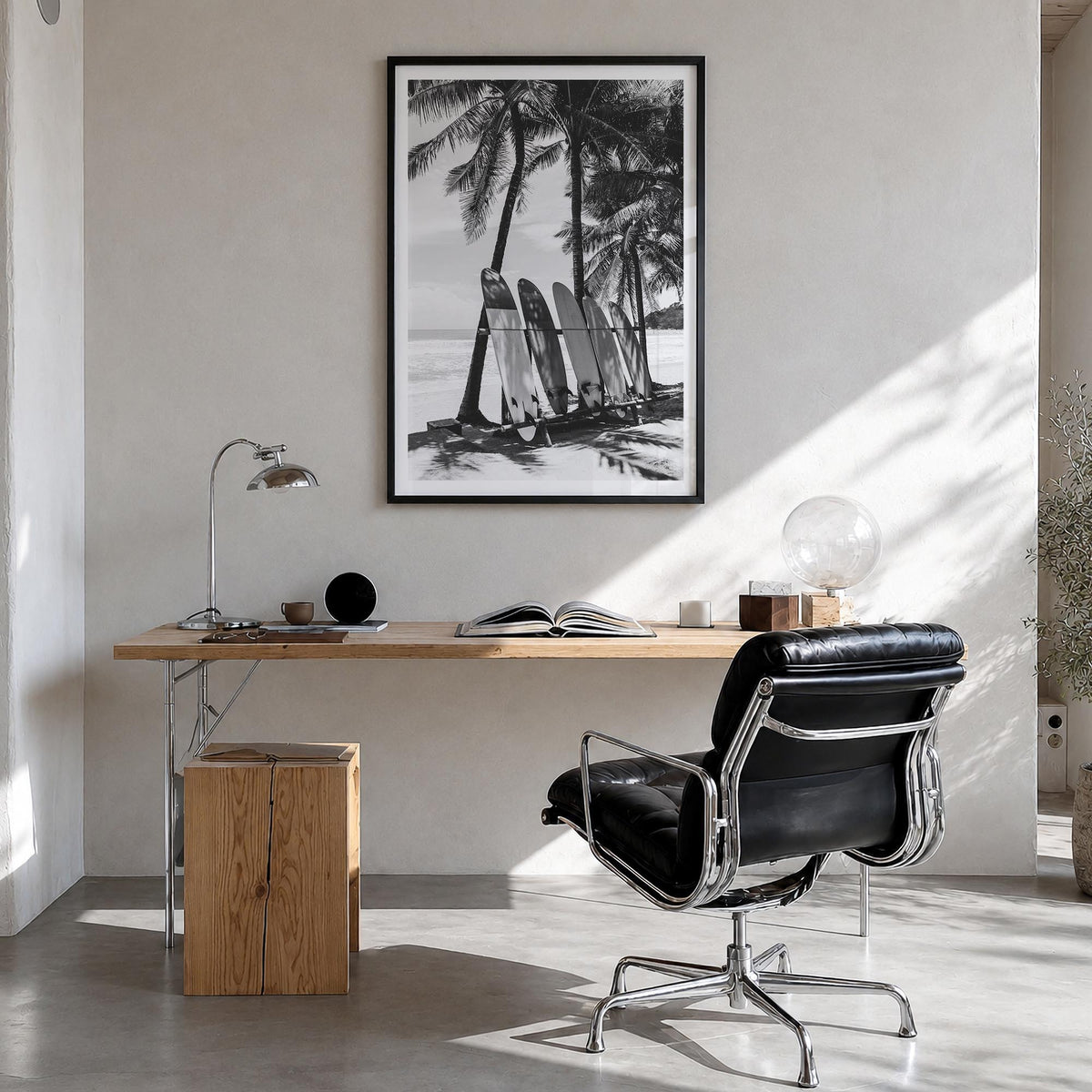 Surfboard no. 2 black & white photo poster – vertical wall art in black wood frame with white border, hanging on wall