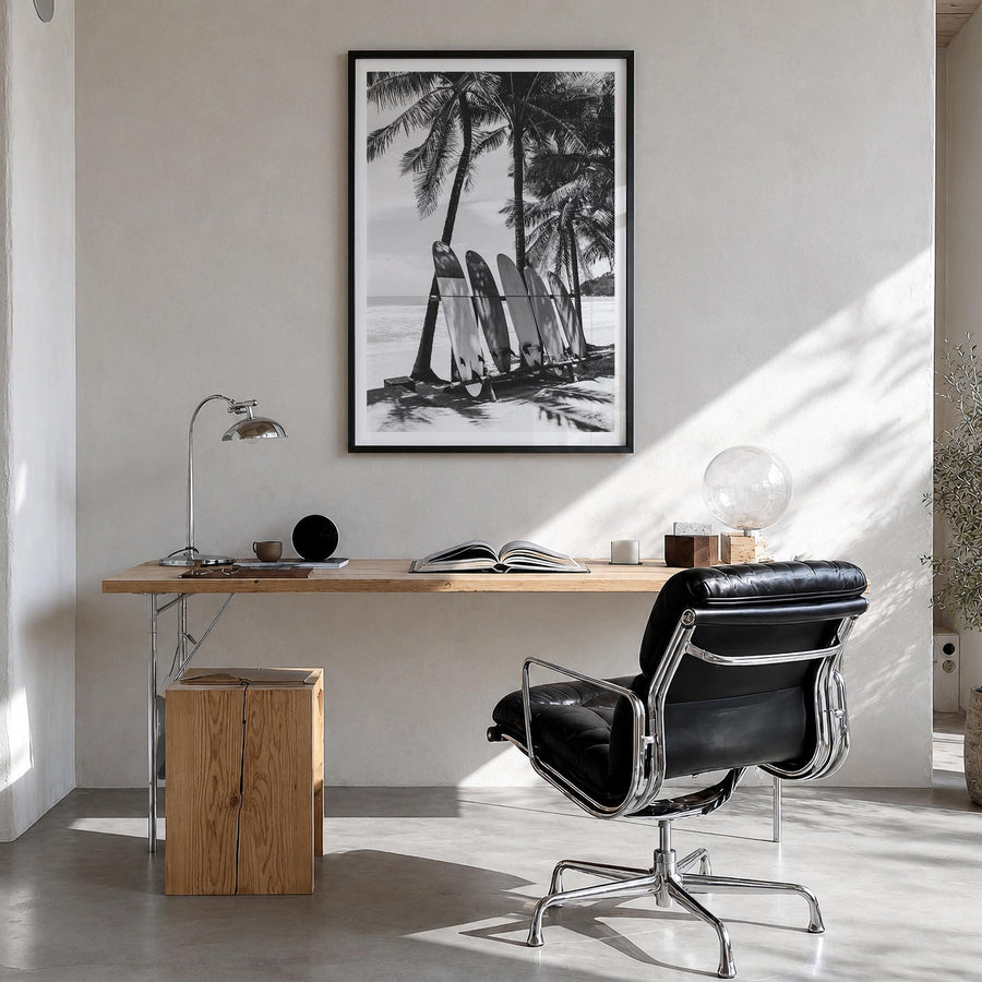 Surfboard no. 2 black & white photo poster – vertical wall art in black wood frame with white border, hanging on wall