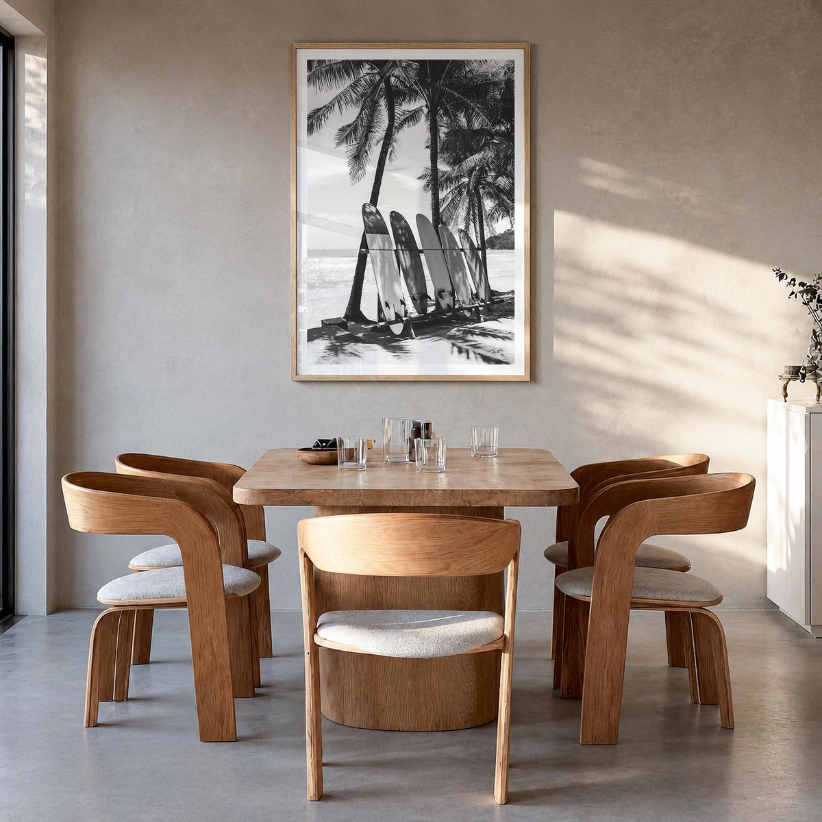 Surfboard no. 2 black & white photo poster – vertical wall art in natural wood frame with white border, hanging on wall