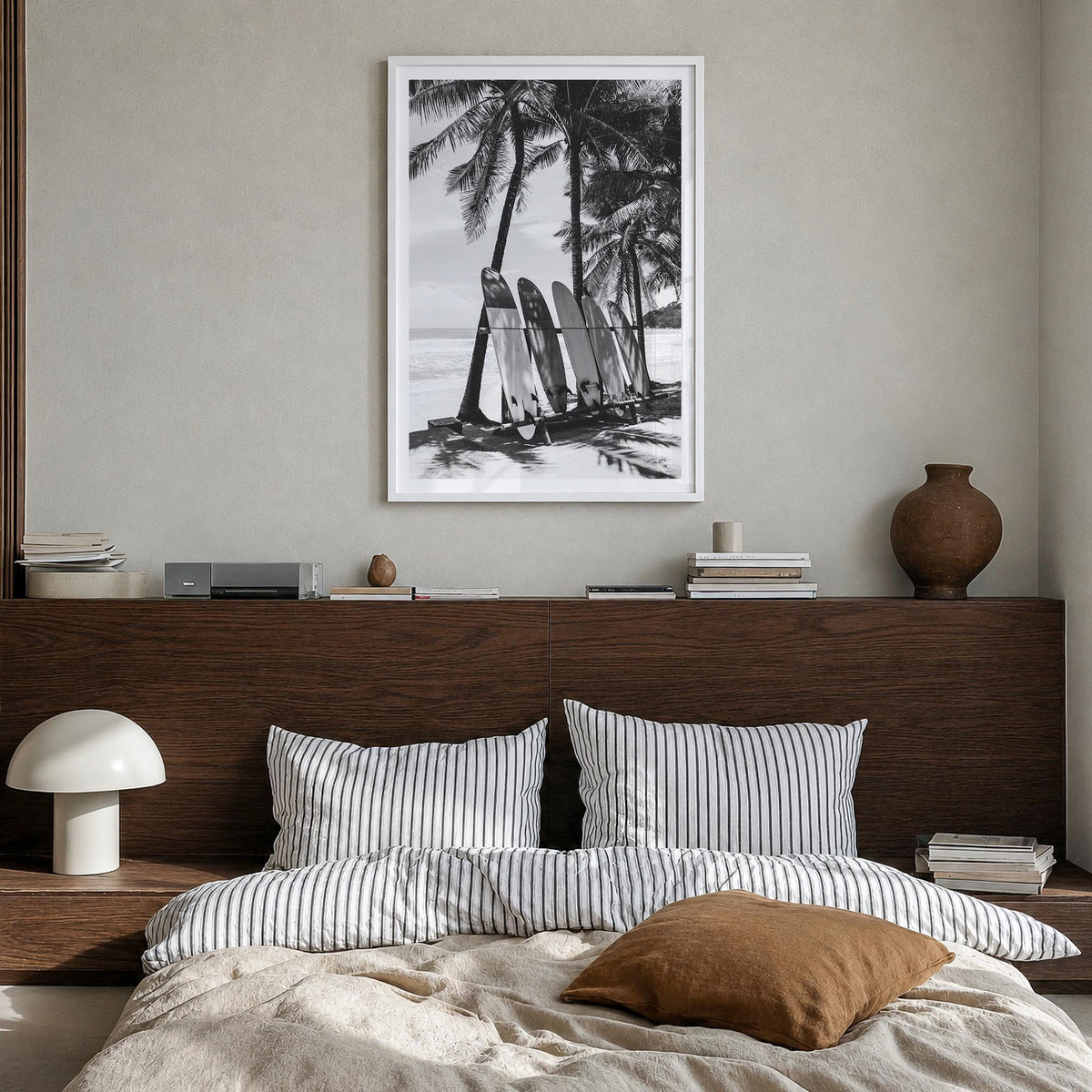 Surfboard no. 2 black & white photo poster – vertical wall art in white wood frame with white border, hanging on wall