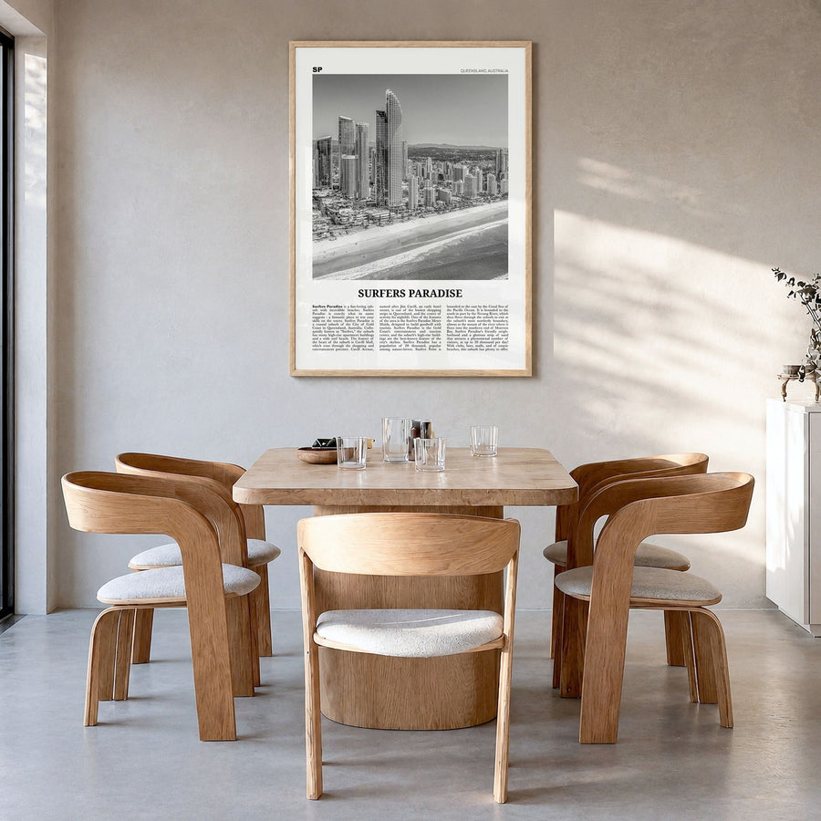 Surfers Paradise Newspaper Poster in a natural wood frame, hanging in a dining room