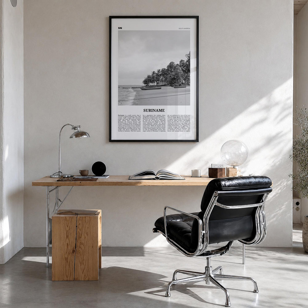 Suriname black & white newspaper poster of South America – vertical wall art in black wood frame, hanging on wall