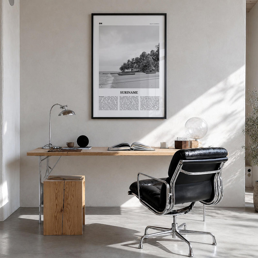 Suriname black & white newspaper poster of South America – vertical wall art in black wood frame, hanging on wall