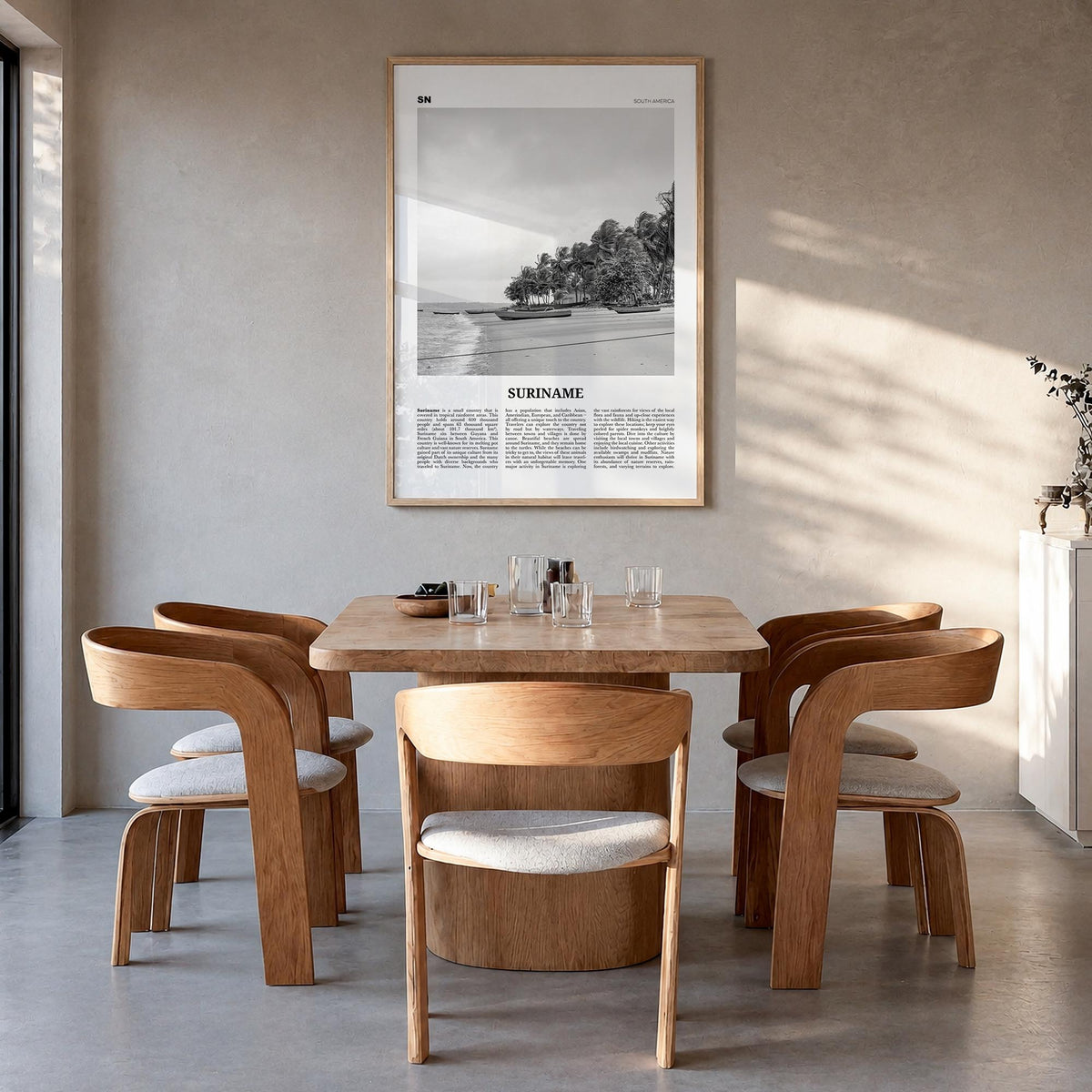 Suriname black & white newspaper poster of South America – vertical wall art in natural wood frame, hanging on wall
