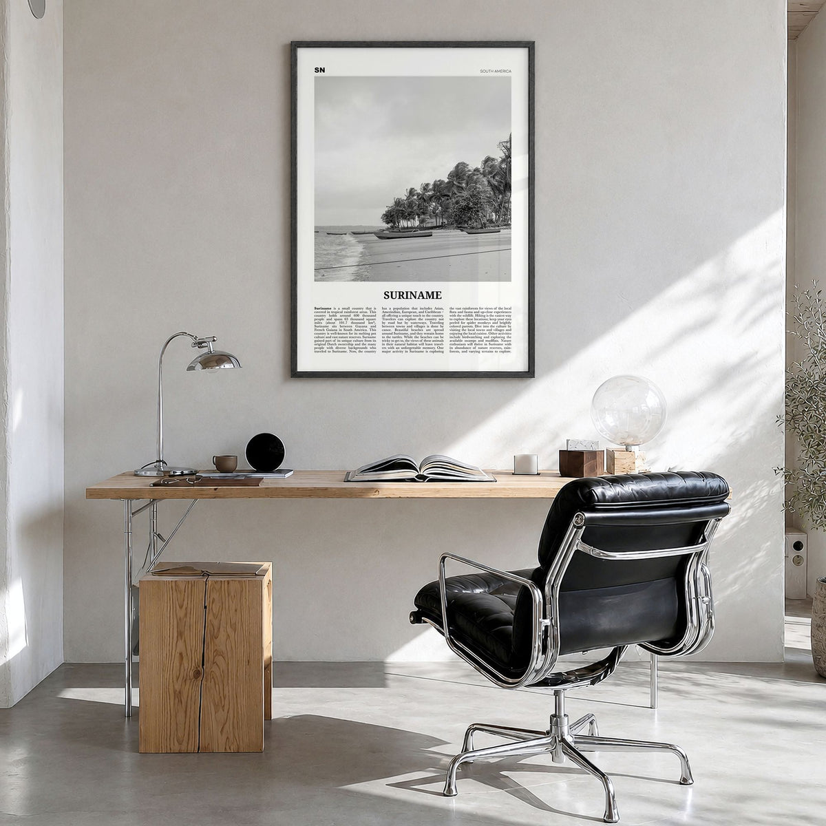 Suriname Newspaper Poster in a black wood frame, hanging in a bright home office