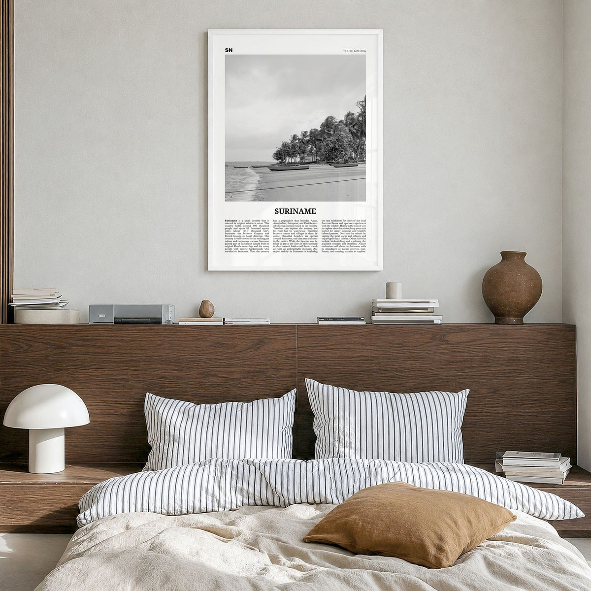Suriname Newspaper Poster in a white wood frame, hanging in a bedroom