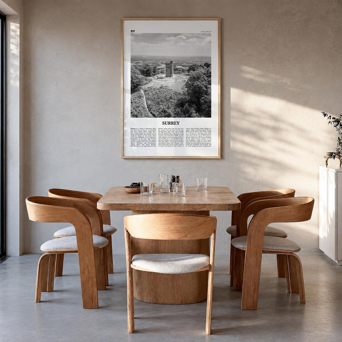 Surrey black & white newspaper poster of England, UK – vertical wall art in natural wood frame, hanging on wall