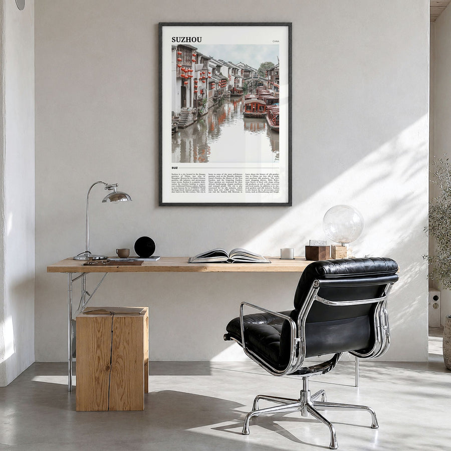 Suzhou Travel Poster in a black wood frame, hanging in a bright home office