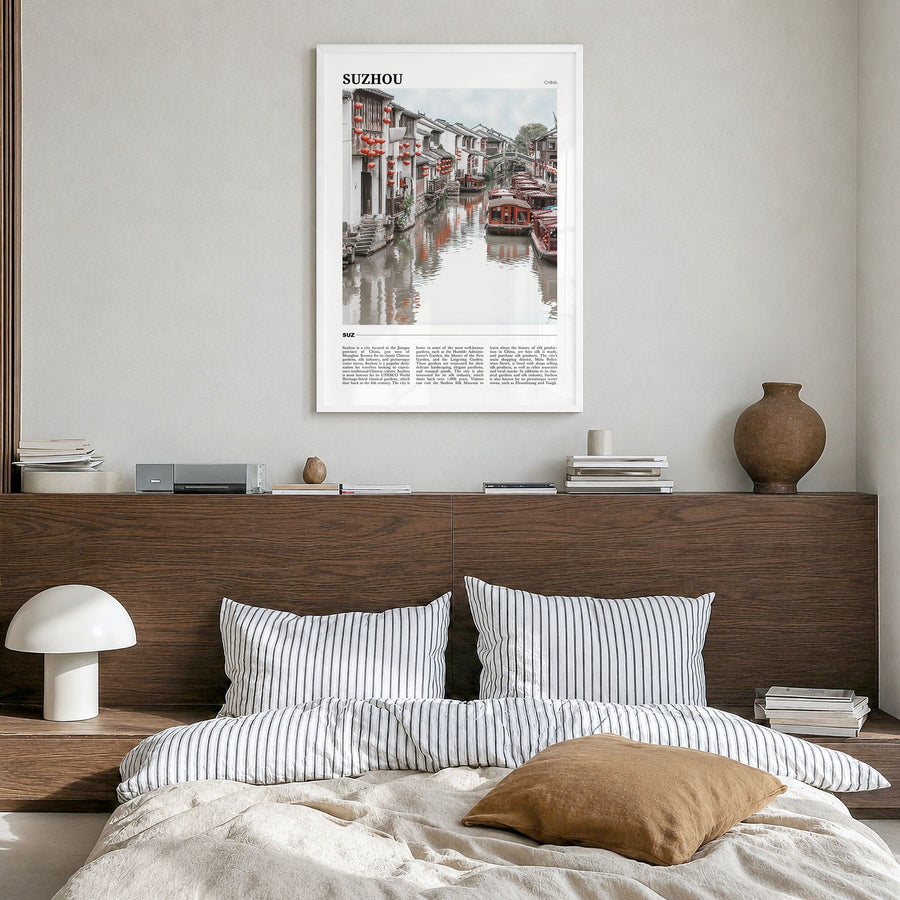 Suzhou Travel Poster in a white wood frame, hanging in a bedroom