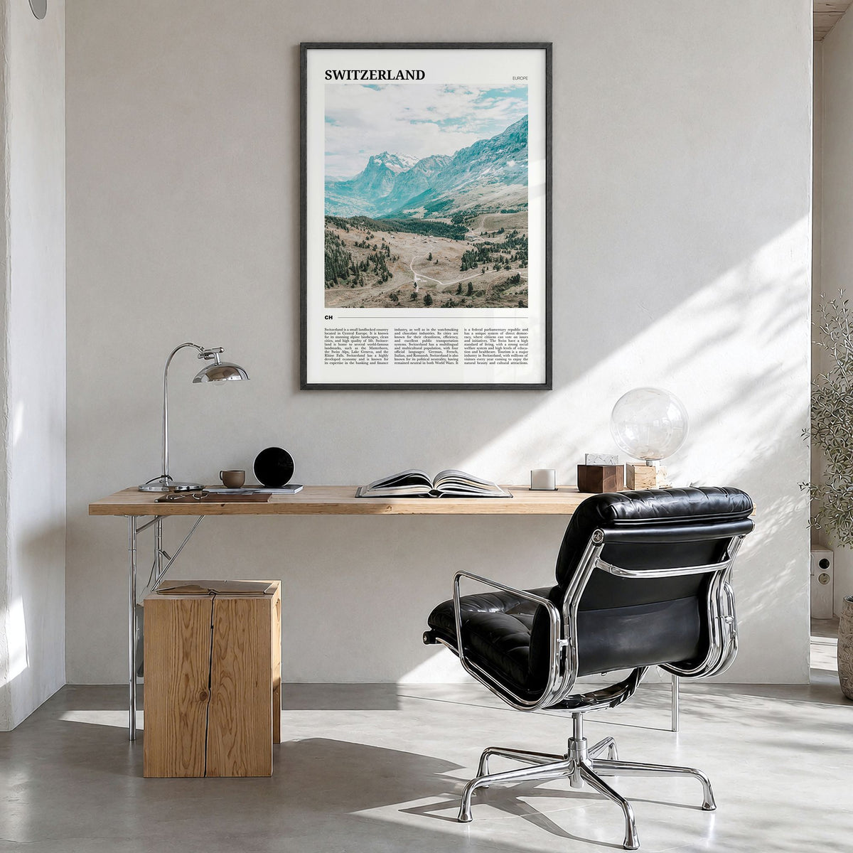 Switzerland Travel Poster in a black wood frame, hanging in a bright home office