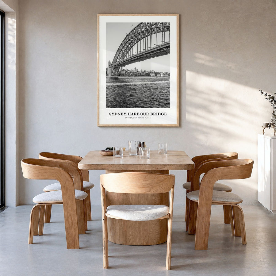Sydney Harbour Bridge Classic Poster in a natural wood frame, hanging in a dining room