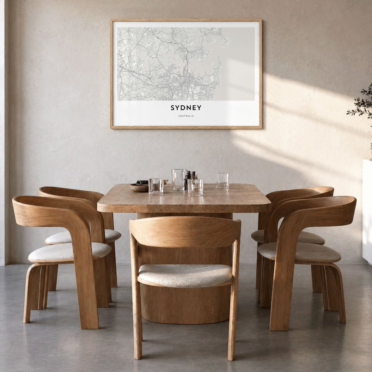 Sydney Map Poster in a natural wood frame, hanging in a dining room