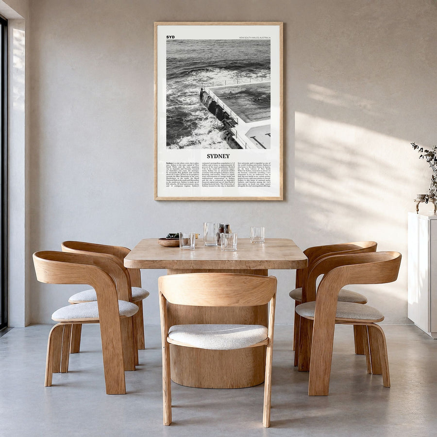 Sydney Newspaper No 4 Poster in a natural wood frame, hanging in a dining room