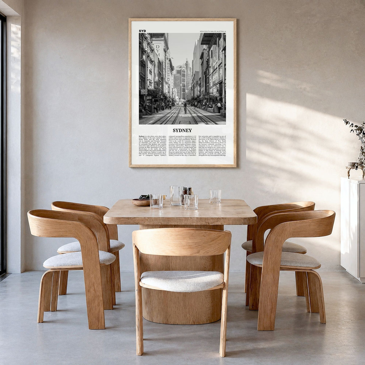 Sydney Newspaper No 5 Poster in a natural wood frame, hanging in a dining room