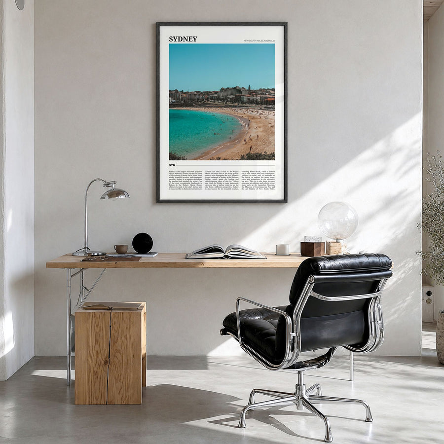 Sydney Travel Poster in a black wood frame, hanging in a bright home office