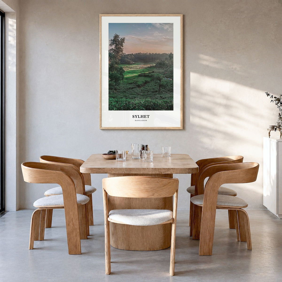 Sylhet Classic Poster in a natural wood frame, hanging in a dining room