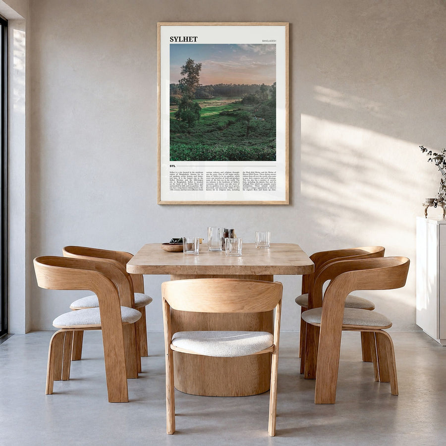 Sylhet Travel Poster in a natural wood frame, hanging in a dining room