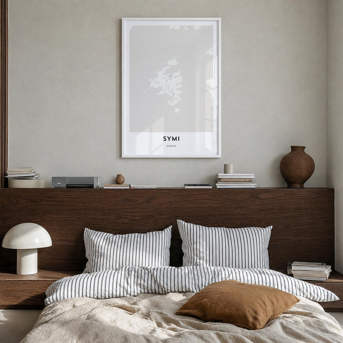 Symi black & white map poster of Greece – vertical wall art in white wood frame, hanging on wall