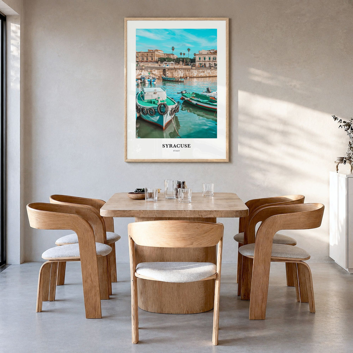 Syracuse, Italy Classic Poster in a natural wood frame, hanging in a dining room