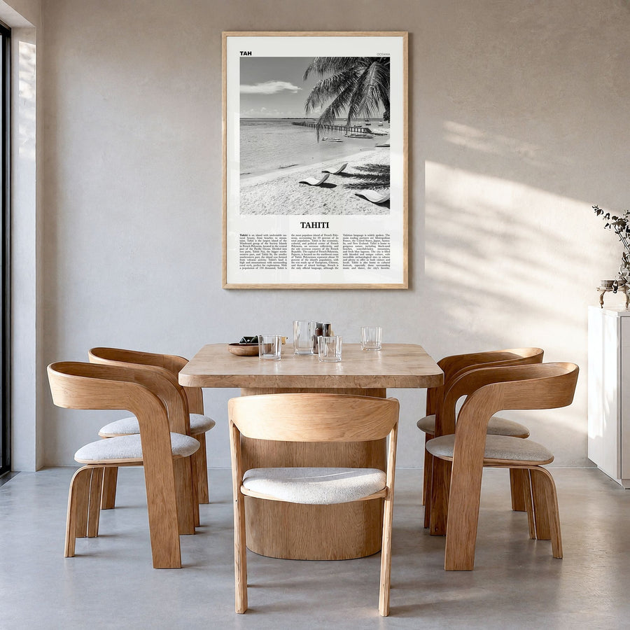 Tahiti Newspaper Poster in a natural wood frame, hanging in a dining room