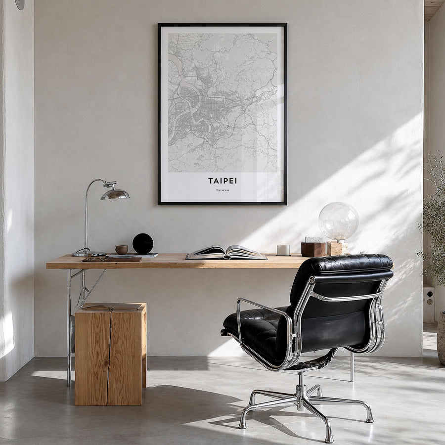 Taipei black & white map poster of Taiwan – vertical wall art in black wood frame, hanging on wall