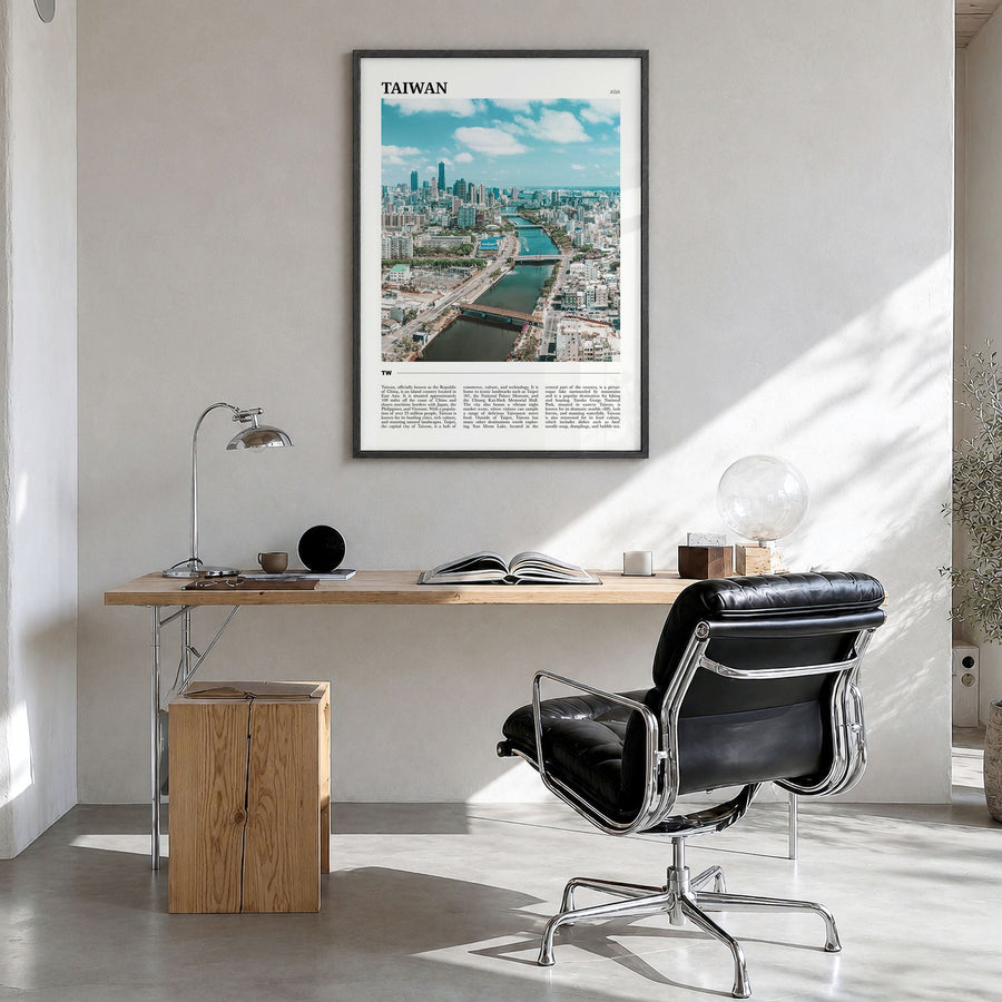 Taiwan Travel Poster in a black wood frame, hanging in a bright home office