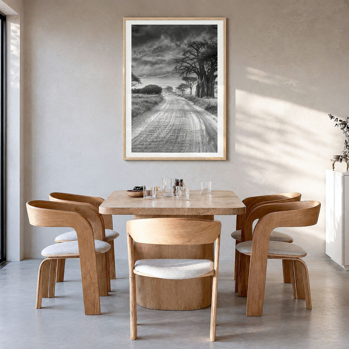 Tanzania Photo Poster in a natural wood frame, hanging in a dining room, white border