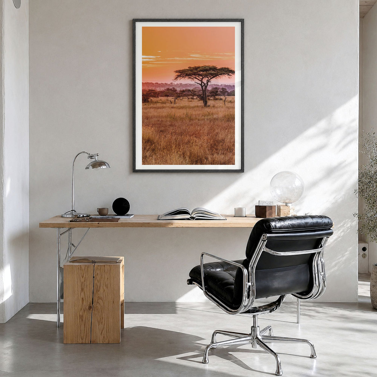 Tanzania Photo Poster in a black wood frame, hanging in a bright home office, white border