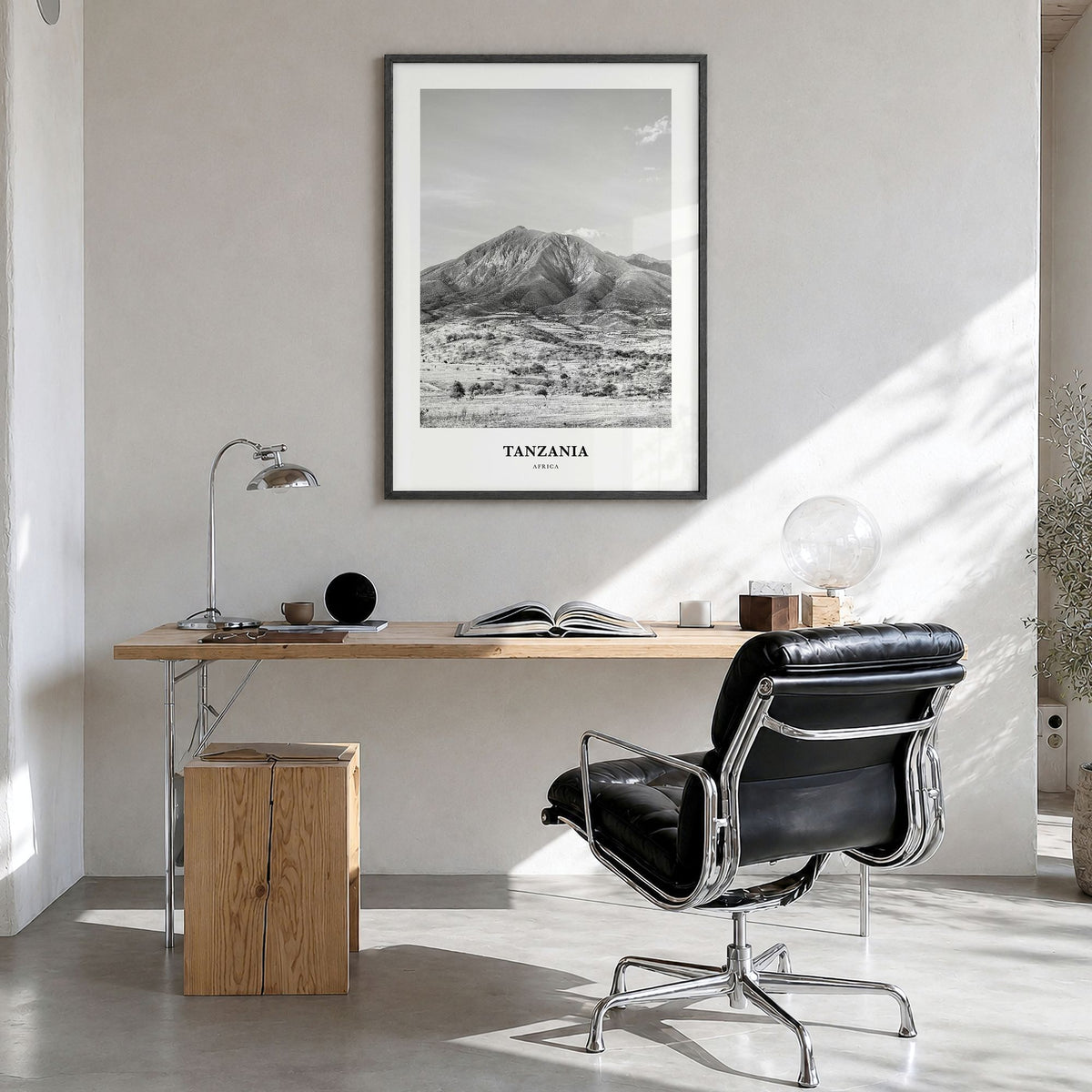Tanzania Classic Poster in a black wood frame, hanging in a bright home office