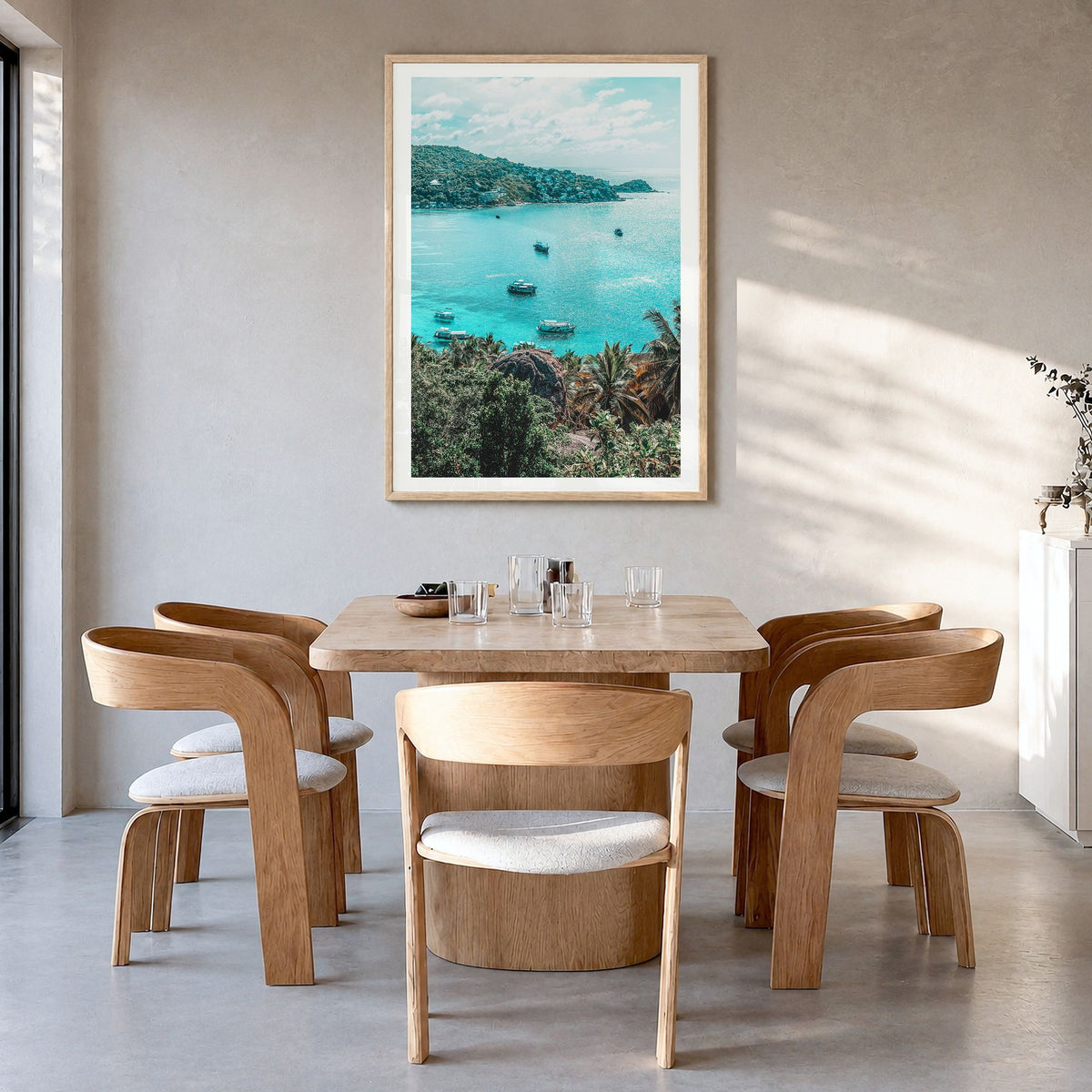 Taos Photo Poster in a natural wood frame, hanging in a dining room, white border