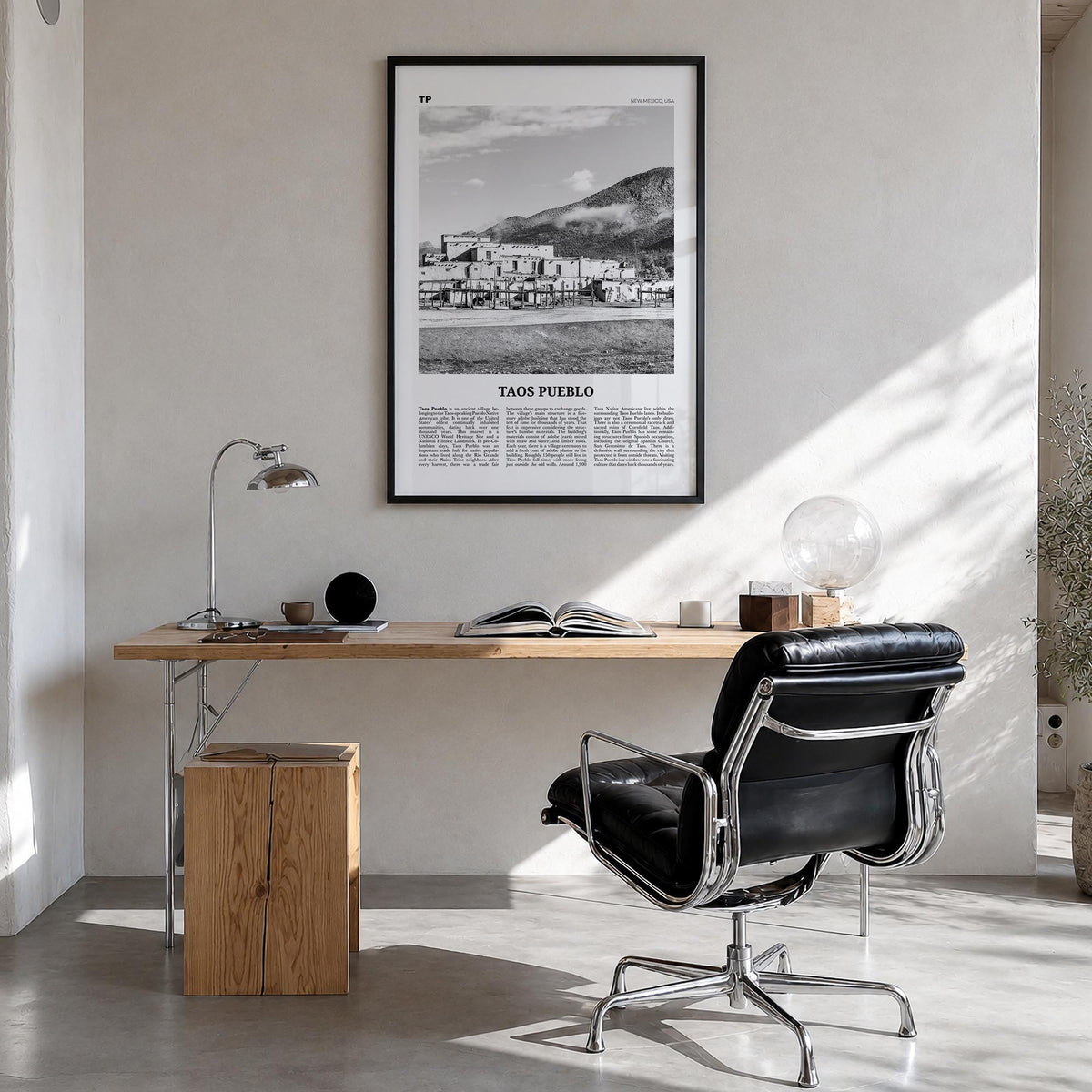 Taos Pueblo black & white newspaper poster of New Mexico, USA – vertical wall art in black wood frame, hanging on wall