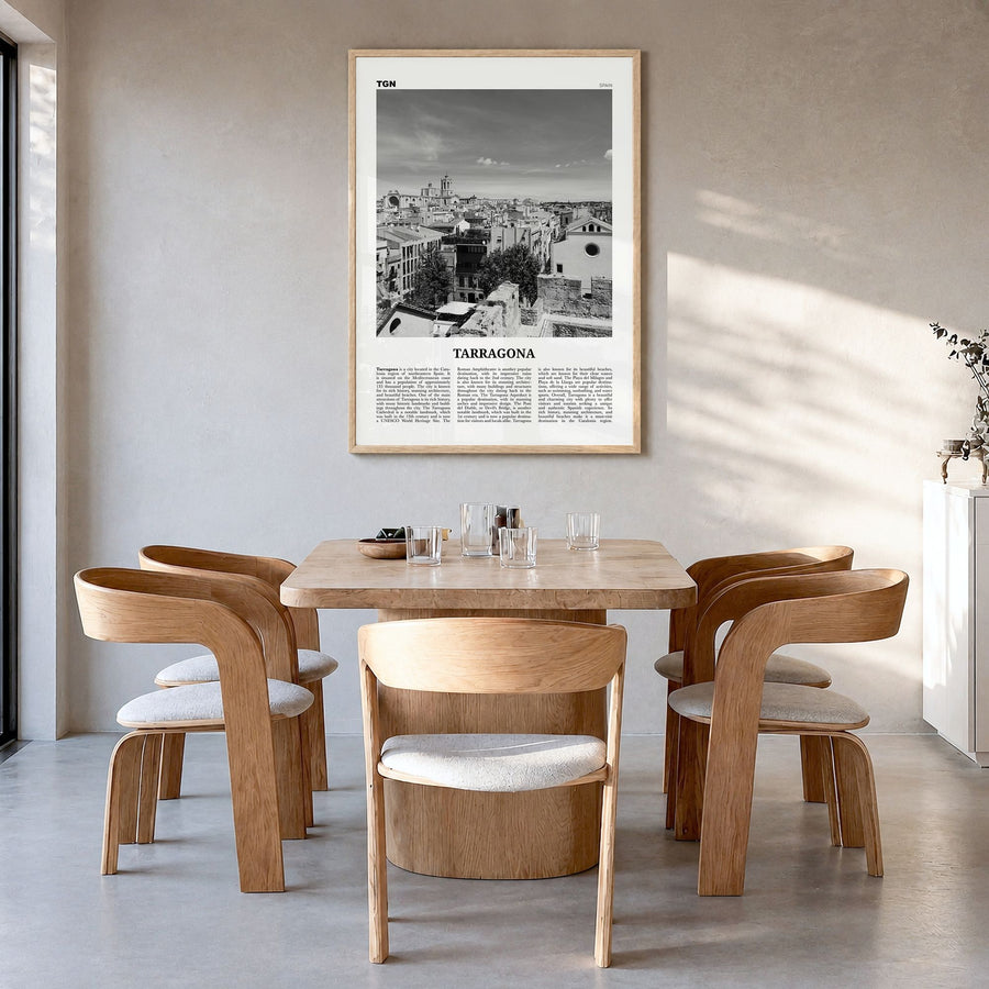 Tarragona Newspaper Poster in a natural wood frame, hanging in a dining room