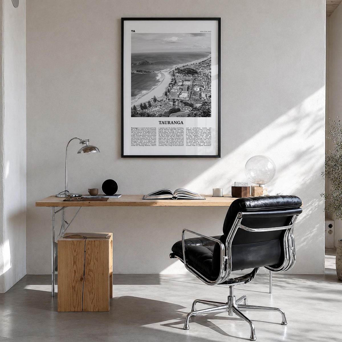 Tauranga black & white newspaper poster of New Zealand – vertical wall art in black wood frame, hanging on wall