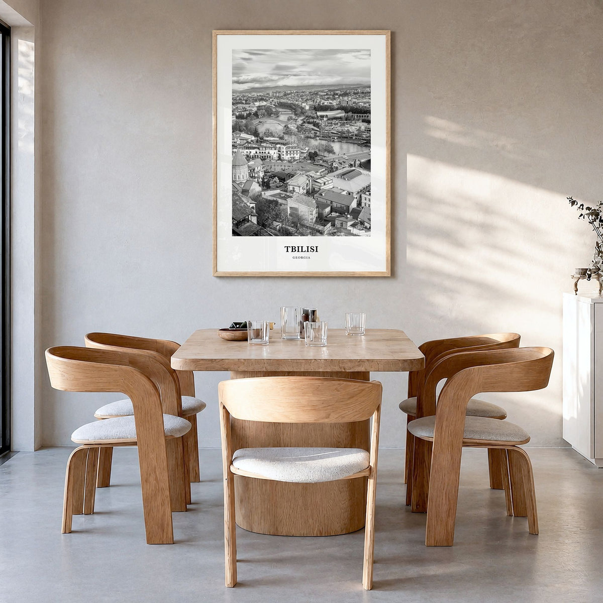 Tbilisi Classic Poster in a natural wood frame, hanging in a dining room