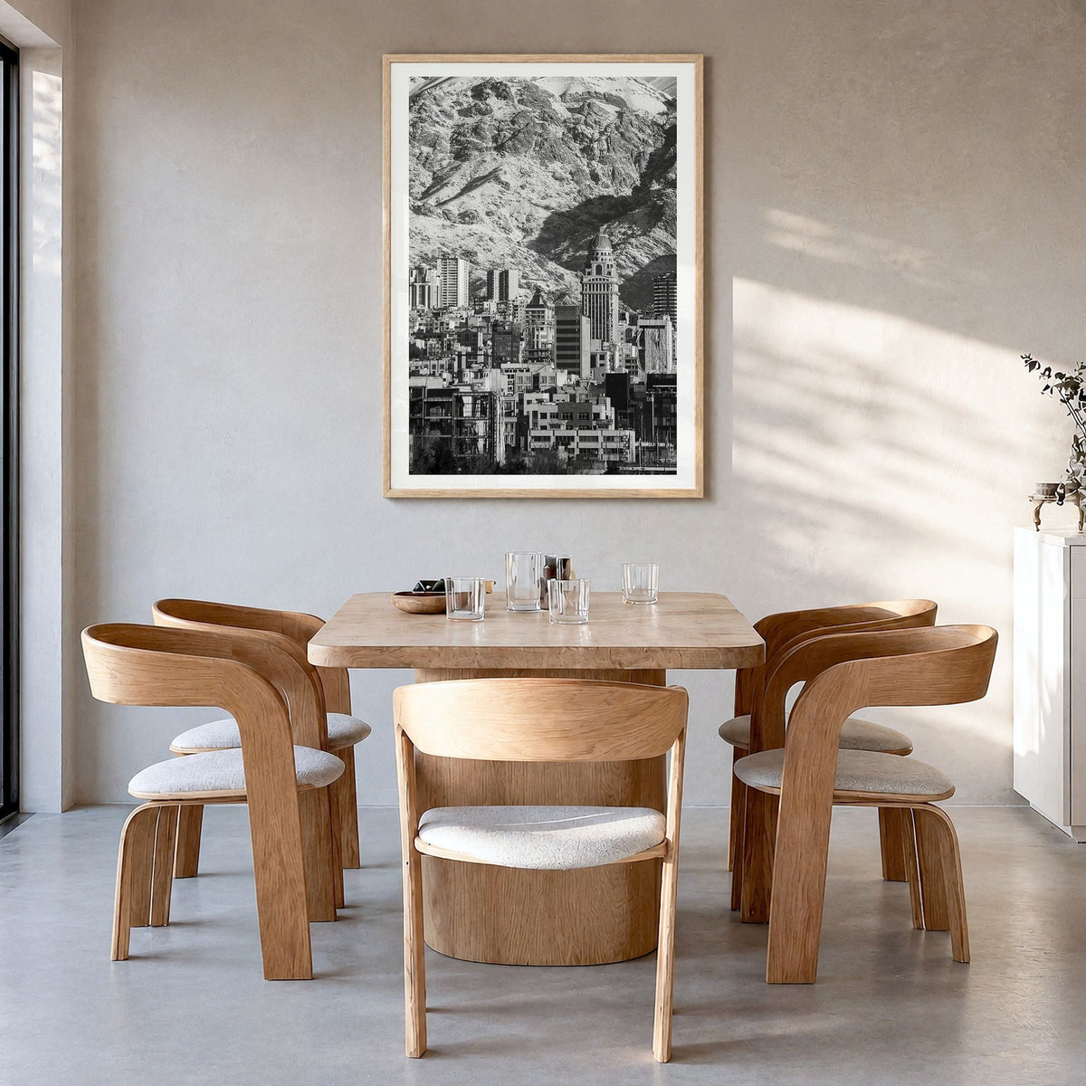 Tehran Photo Poster in a natural wood frame, hanging in a dining room, white border