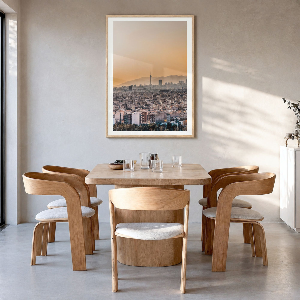 Tehran Photo Poster in a natural wood frame, hanging in a dining room, white border