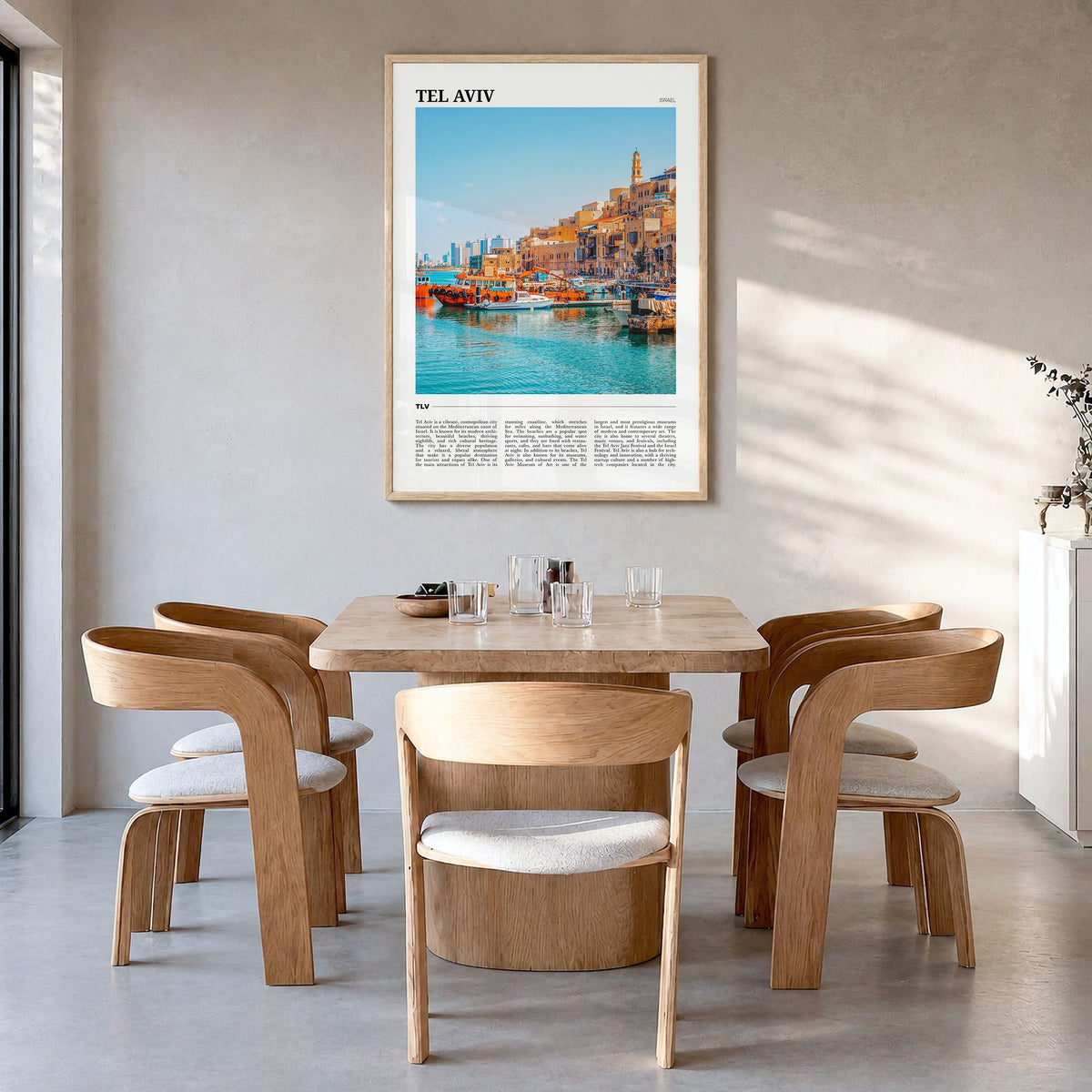Tel Aviv Travel Poster in a natural wood frame, hanging in a dining room