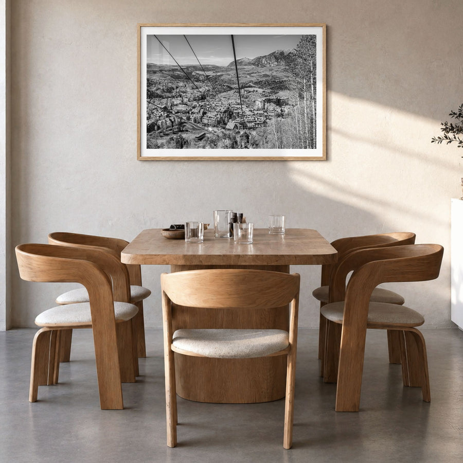 Telluride Photo Poster in a natural wood frame, hanging in a dining room, white border