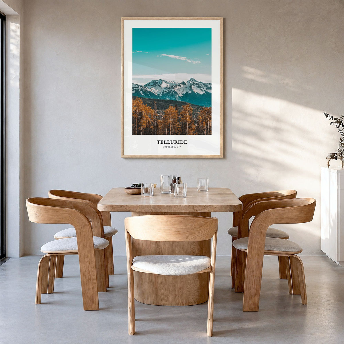 Telluride Classic Poster in a natural wood frame, hanging in a dining room