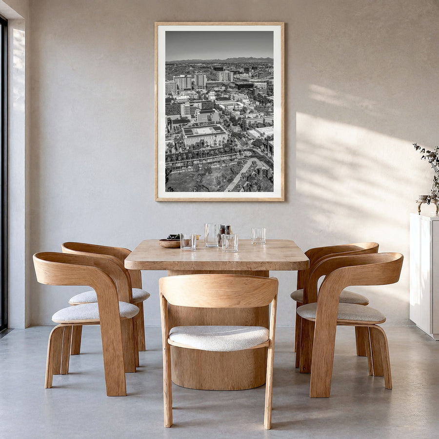 Tempe Photo Poster in a natural wood frame, hanging in a dining room, white border